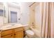 Standard bathroom with vanity, toilet, and shower featuring decorative curtain at 14128 Avenue Of The Grvs, Winter Garden, FL 34787