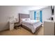 Bright bedroom with a comfortable bed, workspace, and stylish curtains at 14128 Avenue Of The Grvs, Winter Garden, FL 34787