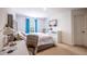 Comfortable bedroom with a TV, work desk, and soft decor for a tranquil living space at 14128 Avenue Of The Grvs, Winter Garden, FL 34787