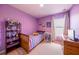 Bright bedroom with a wooden bed frame, decorated with personal items and natural light at 14128 Avenue Of The Grvs, Winter Garden, FL 34787