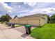 Townhouse exterior featuring attached garages and brick driveway at 14128 Avenue Of The Grvs, Winter Garden, FL 34787