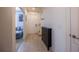 Bright foyer featuring tile floors, neutral walls, and a view into the adjacent living space at 14128 Avenue Of The Grvs, Winter Garden, FL 34787