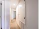 Hallway providing access to various rooms inside the home at 14128 Avenue Of The Grvs, Winter Garden, FL 34787