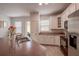 Well-lit kitchen showcases white cabinetry, modern appliances, and an open layout with breakfast bar at 14128 Avenue Of The Grvs, Winter Garden, FL 34787
