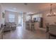 Open-concept living area with modern furnishings and ample natural light, creating an inviting atmosphere at 14128 Avenue Of The Grvs, Winter Garden, FL 34787