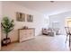 Bright living room with stylish tile flooring, comfortable seating, and elegant decorative accents at 14128 Avenue Of The Grvs, Winter Garden, FL 34787