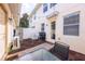 Private patio with brick flooring, furniture, and string lights, perfect for outdoor entertaining at 14128 Avenue Of The Grvs, Winter Garden, FL 34787