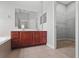 Bathroom featuring a large double sink vanity, tub, and walk in closet at 1509 Cedar Lake Dr, Orlando, FL 32824