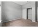 Bedroom featuring neutral carpet, and a closet for ample storage at 1509 Cedar Lake Dr, Orlando, FL 32824