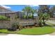 Cedar Bend is a deed-restricted community featuring a brick entrance, mature landscaping, and wrought iron details at 1509 Cedar Lake Dr, Orlando, FL 32824
