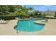 Community pool with ample seating, sunbathing deck, and nearby playground at 1509 Cedar Lake Dr, Orlando, FL 32824