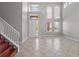 Grand foyer with high ceilings and a staircase, creating an impressive entrance to the home and a welcoming ambiance at 1509 Cedar Lake Dr, Orlando, FL 32824