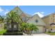 Inviting home with well-maintained landscaping, a two-car garage, and vibrant green grass, offering a warm and welcoming atmosphere at 1509 Cedar Lake Dr, Orlando, FL 32824