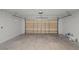 Spacious garage with concrete flooring and ample room for storage at 1509 Cedar Lake Dr, Orlando, FL 32824