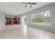The living room has tile floors, recessed lighting, kitchen access, and big windows at 1509 Cedar Lake Dr, Orlando, FL 32824
