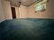 A bright primary bedroom features a colorful accent carpet for a pop of color at 1509 Huntington St, Deltona, FL 32725