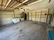 Spacious garage featuring laundry, storage shelves and ample lighting at 1509 Huntington St, Deltona, FL 32725