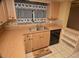 A kitchen featuring wood cabinets, black appliances and bright, natural light at 1509 Huntington St, Deltona, FL 32725