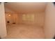The home has neutral carpeting and a large window for lots of light in the living room at 1509 Huntington St, Deltona, FL 32725