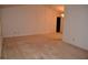 The living room offers neutral carpeting and plenty of open space at 1509 Huntington St, Deltona, FL 32725