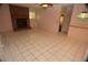 Cozy living room boasts a classic brick fireplace and tile flooring for easy maintenance at 1509 Huntington St, Deltona, FL 32725