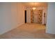 Spacious living room with neutral carpet, chandelier, and floral curtains offering a blank canvas at 1509 Huntington St, Deltona, FL 32725