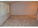 Spacious living room features neutral carpeting and a vaulted ceiling for natural light at 1509 Huntington St, Deltona, FL 32725