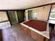 Covered patio with a hot tub and screened in enclosure at 1509 Huntington St, Deltona, FL 32725