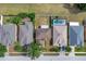 Aerial view of homes with pools, well-manicured lawns, and mature trees at 16053 Wilkinson Dr, Clermont, FL 34714