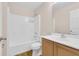 Well-maintained bathroom with a shower-tub combo, toilet, and wooden vanity with sink at 16053 Wilkinson Dr, Clermont, FL 34714