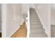 Bright entryway with a staircase, wood floors and white trim at 16053 Wilkinson Dr, Clermont, FL 34714