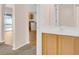 Powder room with wood-look cabinets and sink next to the kitchen at 16053 Wilkinson Dr, Clermont, FL 34714
