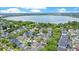 Picturesque aerial view of homes nestled among trees with a stunning lake backdrop at 1636 Hanks Ave, Orlando, FL 32814