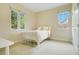 Sunlit bedroom features plush carpeting, neutral walls, and a quaint white metal bed frame at 1636 Hanks Ave, Orlando, FL 32814