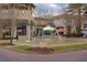 Charming fountain surrounded by colorful flowers and shops in Baldwin Park Village Center at 1636 Hanks Ave, Orlando, FL 32814