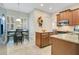 Bright kitchen with an adjacent dining area featuring granite countertops and a cozy breakfast nook at 1636 Hanks Ave, Orlando, FL 32814