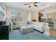 Inviting living room features natural light, plush seating, and an open flow to the kitchen at 1636 Hanks Ave, Orlando, FL 32814