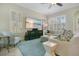 Cozy living room with bright windows, plantation shutters, and comfortable furniture at 1636 Hanks Ave, Orlando, FL 32814