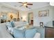 Comfortable living room offering open floor plan, plush sofa, and easy access to kitchen and dining areas at 1636 Hanks Ave, Orlando, FL 32814