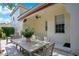 Charming patio with shaded seating, ideal for outdoor dining and enjoying the serene surroundings of the home at 1636 Hanks Ave, Orlando, FL 32814