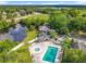 Expansive property featuring a pool, hot tub, gazebo, and pond surrounded by lush greenery, offering serene outdoor living at 1751 Chatham Cir, Apopka, FL 32703