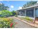 Landscaped backyard with a screened patio; enjoy outdoor relaxation and entertainment at 1751 Chatham Cir, Apopka, FL 32703