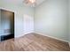 Bedroom showcases light green walls, wood-look floors, and a closet at 1751 Chatham Cir, Apopka, FL 32703