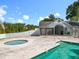 Community pool area with a bath house, hot tub, and fenced perimeter, offering a refreshing and safe outdoor space at 1751 Chatham Cir, Apopka, FL 32703