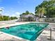 Community pool with a bath house, hot tub, and fenced perimeter offering a refreshing and safe outdoor space at 1751 Chatham Cir, Apopka, FL 32703