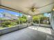 Screened porch with fan; perfect for outdoor seating with views of the landscaped backyard at 1751 Chatham Cir, Apopka, FL 32703