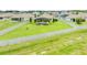A vast lawn features an elegant screened-in pool, perfect for outdoor enjoyment at 1789 Chatsworth Cir, St Cloud, FL 34771