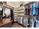 Well-organized walk-in closet featuring custom shelves, hanging rods, and abundant storage solutions at 1789 Chatsworth Cir, St Cloud, FL 34771