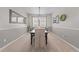 Formal dining room with elegant decor, stylish lighting, and seating for six at 1789 Chatsworth Cir, St Cloud, FL 34771