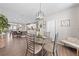Open concept dining area adjacent to kitchen, featuring modern light fixture and stylish furnishings at 1789 Chatsworth Cir, St Cloud, FL 34771